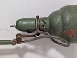 a close up of a green light on a wall