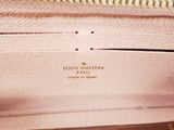 the inside of a louis vuitton pink leather wallet