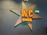 a large star sign on the wall of a restaurant