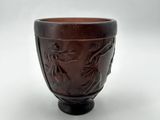 an image of a brown bowl with a dragon design on it