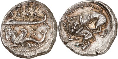 a silver coin with an image of a dragon and a lion on it