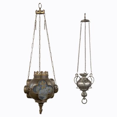 two antique brass hanging lamps with chains and a clock