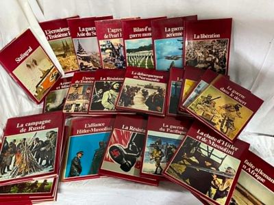 books on a bed with a white sheet in the background