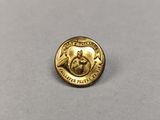 a close up of a gold coin with a bird on it