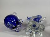 a glass figurine of a football player and a football helmet