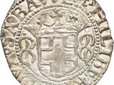 une vieille pièce d'argent sur laquelle figure un blason