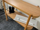 a wooden table with a computer on top of it