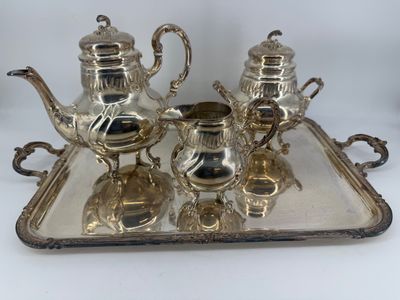 silver plated tea and coffee set on tray on white background