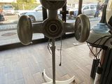an image of a hair dryer on a stand in front of a window