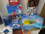a lot of books and games on the table