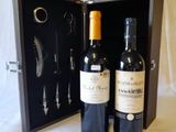 two bottles of wine in a case with a corket