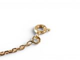 a close up of a chain on a white surface