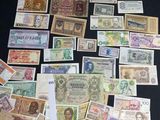 many different types of paper money on the table