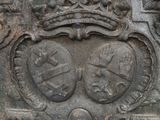 a stone plaque with a crown on top of it
