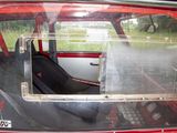 a red car with a black seat in the back