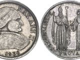 a close up of a coin with a woman and a man on it