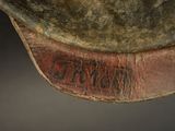 a close up of the bottom of a hat with writing on it