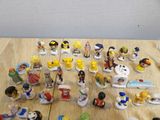 a lot of figurines that are on the table