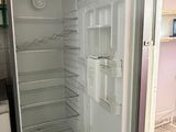 an open refrigerator in a kitchen with no door