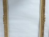 an antique gold picture frame on a white background