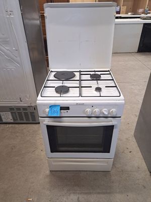 stove with white top and black burners in a kitchen area
