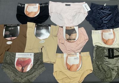 a lot of panties that are sitting on a bed