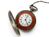 an old pocket watch with roman numerals on it