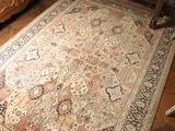 a rug on the floor in a living room