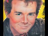 the front cover of a magazine with a picture of a man smiling