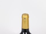 a bottle of wine that is sitting on a table