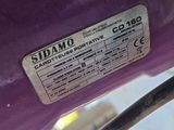 a close up of a label on a purple motorcycle