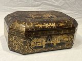 a decorative box that is sitting on a white surface