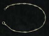 a silver bracelet with a chain and a clasp on a black background