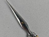 a pair of scissors that are sitting on a table