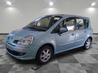 a picture of a small blue car on a checkered floor