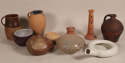 many different types of vases sitting on a table