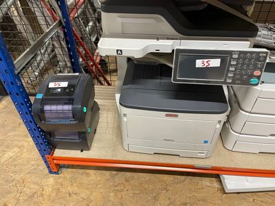many different printers and scanners on the shelves