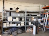many shelves with boxes and boxes on them in a garage