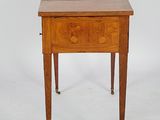 an image of a small table with a drawer on it