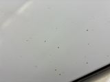 a close up of a laptop computer with a lot of dirt on it