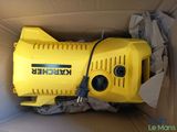 the box is full of a yellow blower sitting on the floor