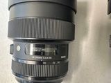 a camera lens sitting on top of a table next to a camera