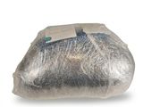 a bag of fish wrapped in plastic on a white surface