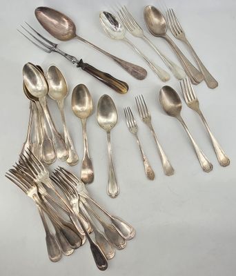 a lot of silver spoons and forks on the table