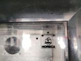 a close up of a glass door with a sign on it
