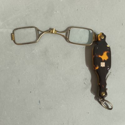 a close up of a pair of glasses on a table