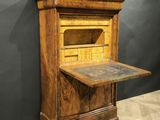 an old wooden desk with a drawer on top of it