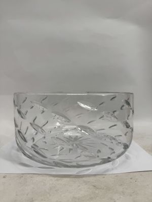 the glass bowl is sitting on top of a piece of paper