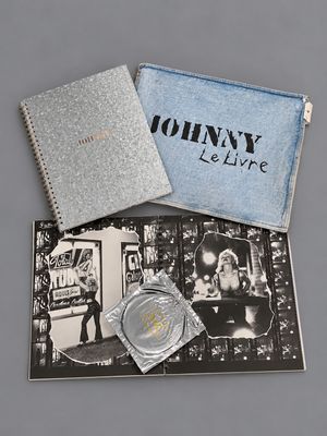 the contents of a john lelive watch are shown in a blue case