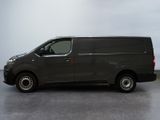 a picture of a grey van parked in a room